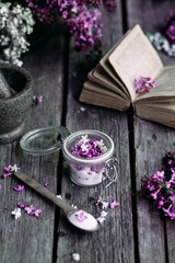 Sugar with lilac on a wooden table