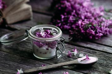 Sugar with lilac on a wooden table