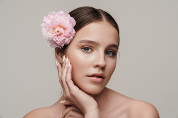 Image of seductive nice shirtless woman posing with pink peony