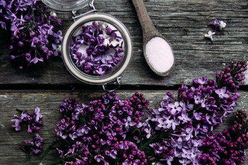 Fototapeta na wymiar Sugar with lilac on a wooden table