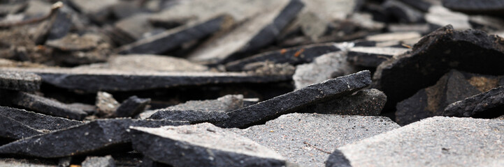 Fragments asphalt from road surface, destruction