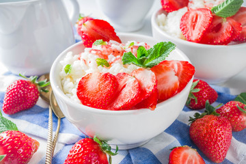 Summer morning rice pudding or rice porridge with strawberry and berry syrup in small bowl for, With milk and fresh strawberry copy space