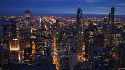 CHICAGO, ILLINOIS, UNITED STATES - DEC 11th, 2015: Aerial view of Chicago downtown at twilight from John Hancock skyscraper high above - obrazy, fototapety, plakaty