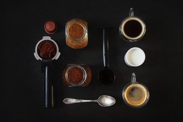 Flat lay of making coffe. Isolated on black background. Top view, flat lay.