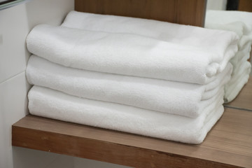 Folding white towel in bathroom in the resort