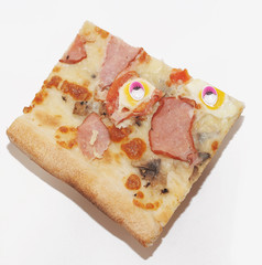 Slice of pizza with plastic eyes on white background. Abstract photo of food.