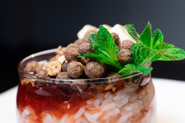 Fresh oatmeal and rice porridge with a beautiful serving and fruit. Bananas, berries, oranges and kiwi. Healthy and nutritious breakfast for children and adults. Different cereals