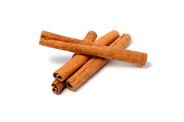 Cinnamon Sticks Stacked isolated on White background closeup macro shot