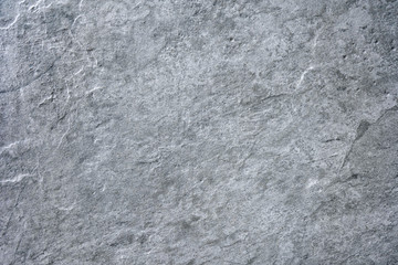 Grey stone texture cement concrete, rock plastered wall stucco, painted flat fade background of marble grey solid floor grain. Rough top graphite ceramic tile.Decoration for home.