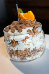 Fresh oatmeal and rice porridge with a beautiful serving and fruit. Bananas, berries, oranges and kiwi. Healthy and nutritious breakfast for children and adults. Different cereals