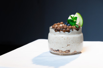 Fresh oatmeal and rice porridge with a beautiful serving and fruit. Bananas, berries, oranges and kiwi. Healthy and nutritious breakfast for children and adults. Different cereals