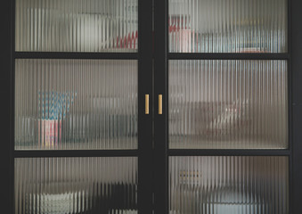 dishware hidden behind corrugated glass