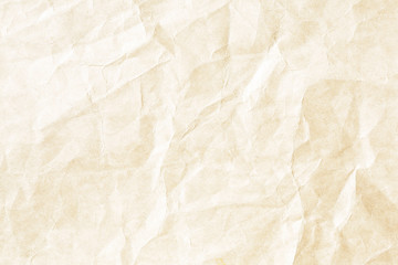 Old pale yellow crumpled paper background texture