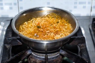 Cook Famous home made asian instant noodle in a porcelain bowl . Close up