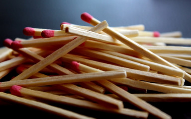 Pile of several matchsticks on black background