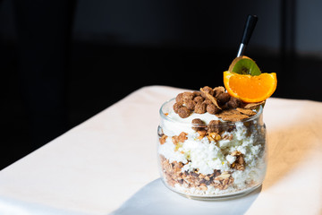 Fresh oatmeal and rice porridge with a beautiful serving and fruit. Bananas, berries, oranges and kiwi. Healthy and nutritious breakfast for children and adults. Different cereals