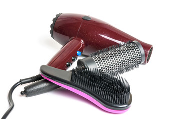 Hair dryer and hairbrushes isolated on white background.