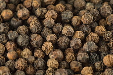 Black peppers peas background
