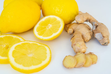 Lemon and ginger closeup on a white background. Alternative medicine. Food protection against viruses, coronavirus, immunity concept. Stay home.