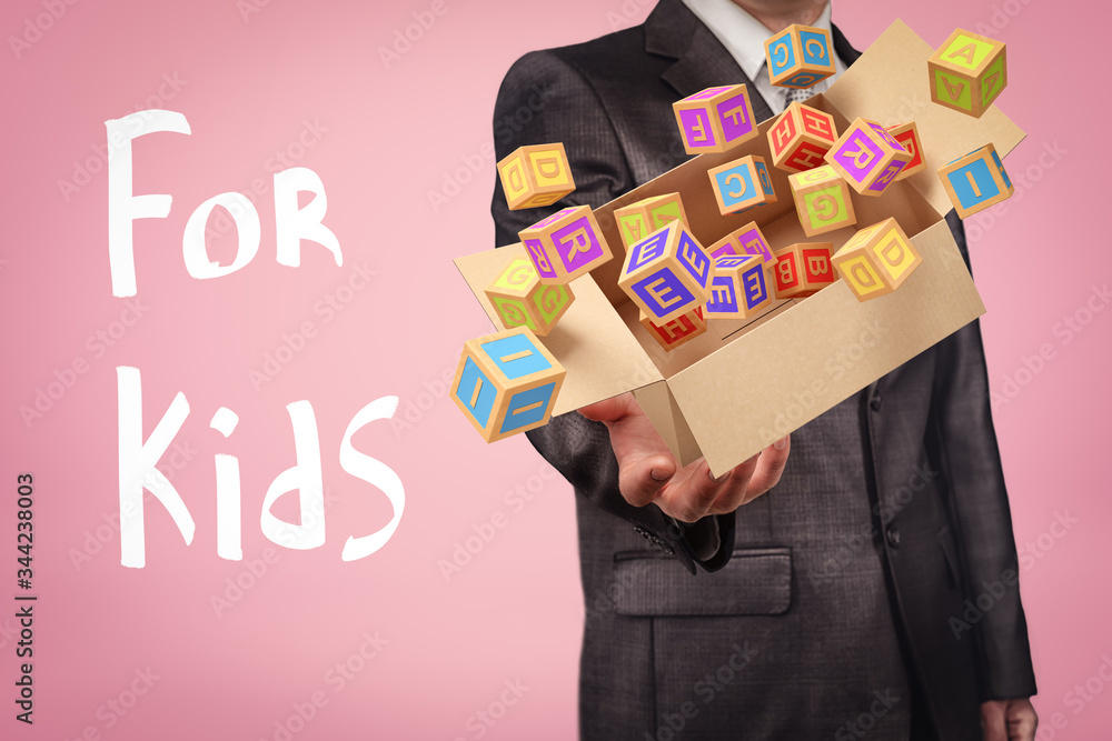 Poster crop image of anonymous businessman levitating carton box with colorful abc blocks that fly out of i
