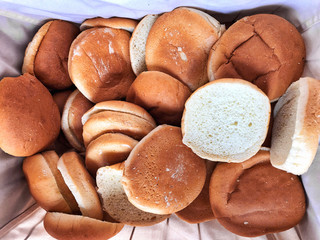 A basket of sandwich bread bun. The Coronavirus could spark global food crisis and food prices are rising concept and background. Top view and close up. 