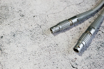 close up of audio cable metal connector on grey background