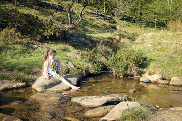 Children in river in English Countryside