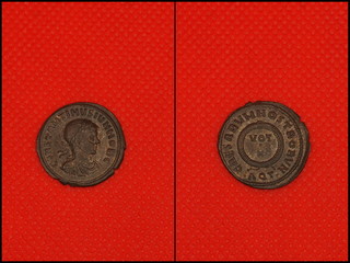Roman coins on red background. Front and back. Roman. Emperor