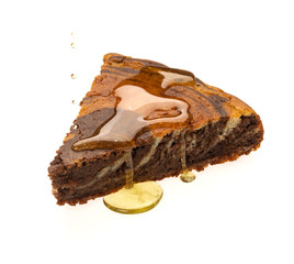 A piece of fresh honey-soaked pie on a white background. Delicious chocolate cake