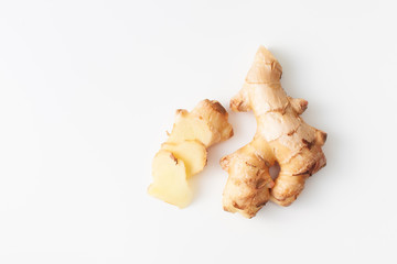Young fresh cut ginger root on white background