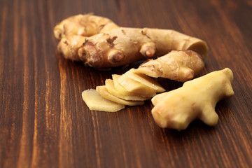 Chopped and peeled young ginger root on a wooden table