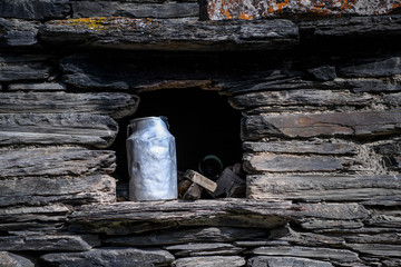 A milk can is placed on a stone window sill in Dartlo in the Tusheti region.