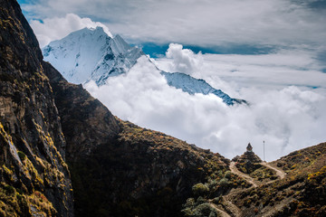 Road to the temple in cloudy mountains