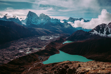 Beautiful mountain lake Gokyo covered by clouds