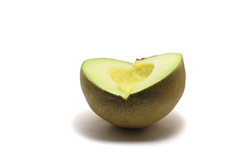 A seedless sliced honeydew green melon (Cucumis melo) isolated on white background, perfect for breakfasting during ramadan