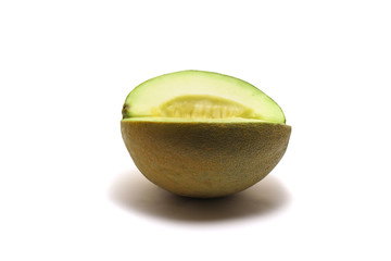 A seedless sliced honeydew green melon (Cucumis melo) isolated on white background, perfect for breakfasting during ramadan