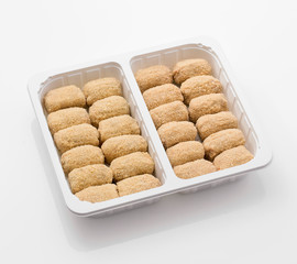 uncooked kibble in a white blister