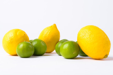 Portrait Of Lemons And Limes Against White Background