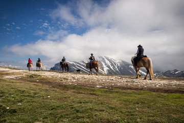 Horse riders on the Montebaldo mountain, Malcesine, Italy