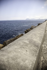 Fototapeta na wymiar Stone dam in the sea