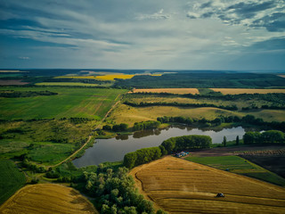 Naklejka premium Green fields aerial view before harvest at summer