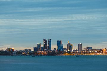 Naklejka premium TALLINN, ESTONIA - SEPTEMBER 30, 2018: Scenic blue hour view of business city block skyline. Tallinn, Estonia.