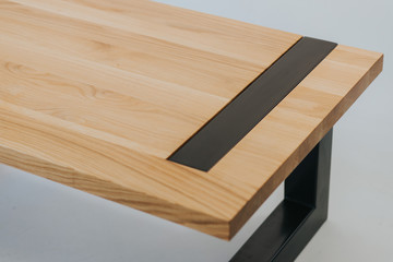 wooden table with metal legs on white background