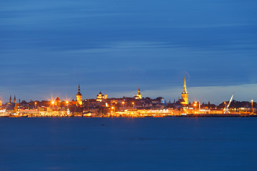 Scenic blue hour view of old town and harbor skyline. Tallinn, Estonia.