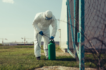 Naklejka premium Cleaning and Disinfection outside around buildings, the corona-virus epidemic.