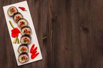 Korean roll Gimbap(kimbob). Steamed white rice (bap) and various other ingredients. Trendy black background