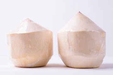 Portrait Of Two Coconuts Against White Background