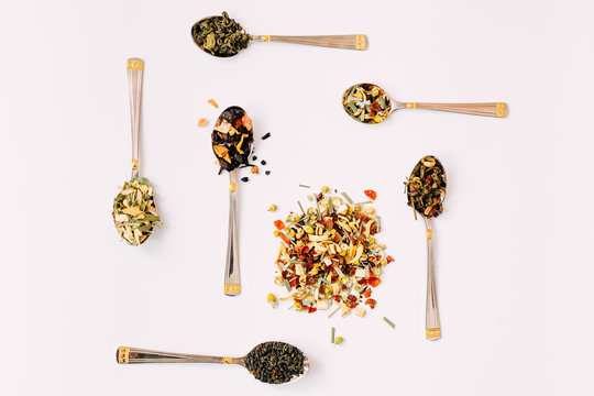 Spoons with various types of  teas. Artistic composition. Top view image concept.