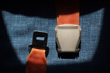 Close up view on aircraft seat belt for passanger. High contrast shot.