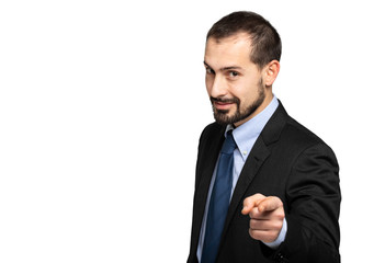 Handsome businessman pointing his finger at you